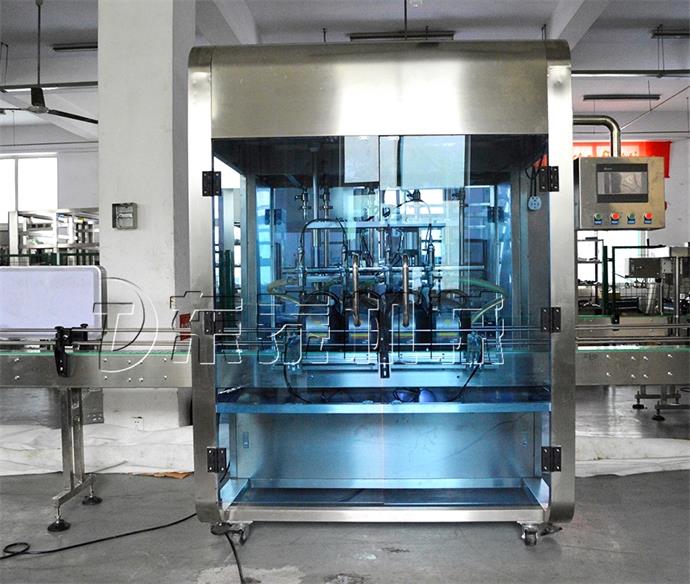 全自動(dòng)油類灌裝機(jī).jpg 全自動(dòng)油類灌裝機(jī).jpg